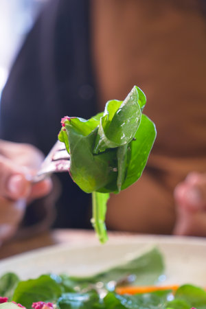 Colorful salad served on forkの写真素材