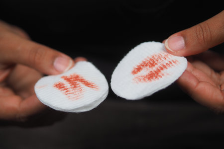 Lips leaving marks on cotton pads during a makeup sessionの写真素材