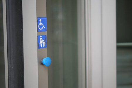 Accessibility signs at public building entrance