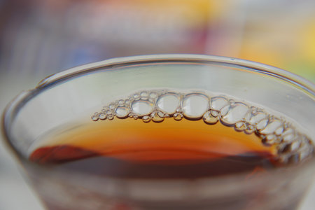 Close-up view of bubbling beverage in a clear glassの写真素材