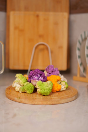 Fresh colorful vegetables arranged on a wooden boardの写真素材