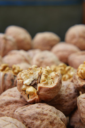 Freshly cracked walnuts on display at a market stallの写真素材