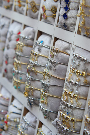 Colorful jewelry display at a market stall in the afternoon