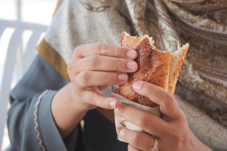 Woman delighting in fresh bread outside