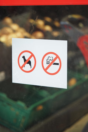 No dogs or smoking signs displayed at store entranceの写真素材