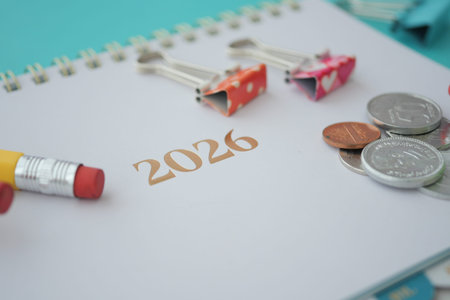 Planning for financial goals in 2026 with a colorful plannerの写真素材