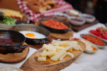 Delicious traditional breakfast spread on a wooden tableの写真素材