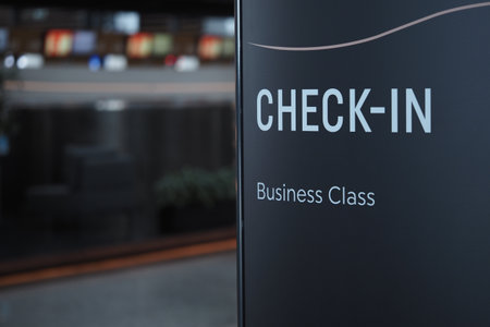 Check-in sign for business class at airport terminalの写真素材