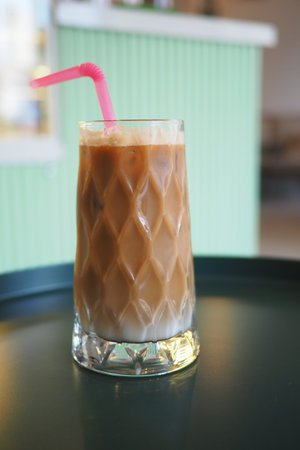 Delicious iced coffee drink served with a straw
