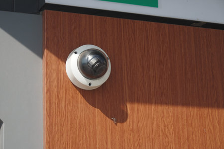 Security camera mounted on a wooden near ATM