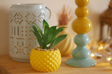 Yellow decor with plants and candles in a cozy spaceの写真素材