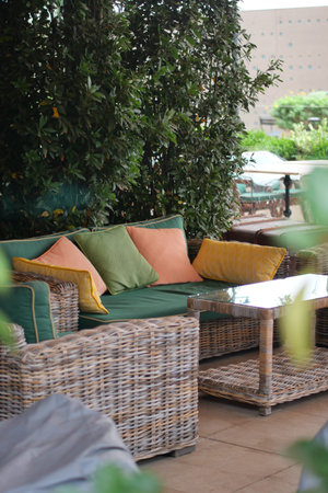 Colorful outdoor seating with cushions and plantsの写真素材