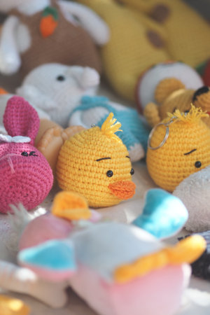 Colorful crochet toys arranged on a soft surfaceの写真素材