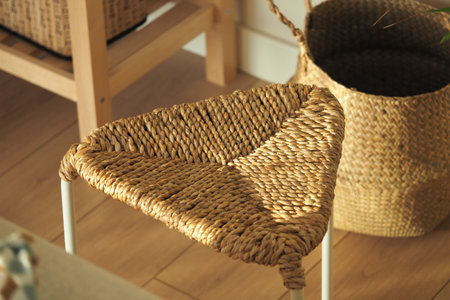 Unique woven chair in a bright indoor settingの写真素材