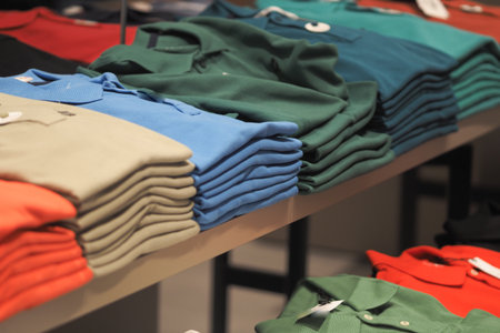 Display of folded shirts in a retail store sectionの写真素材