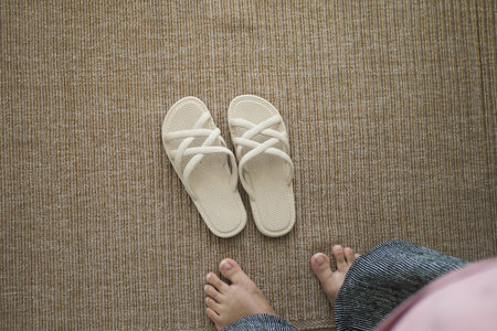 Comfortable sandals resting on a textured floor