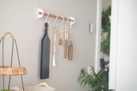 Modern kitchen wall decor with wooden hooks and accessories