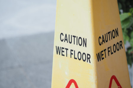 Caution sign indicating wet floor in public area