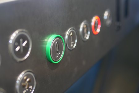 Illuminated elevator control panel in a buildingの写真素材
