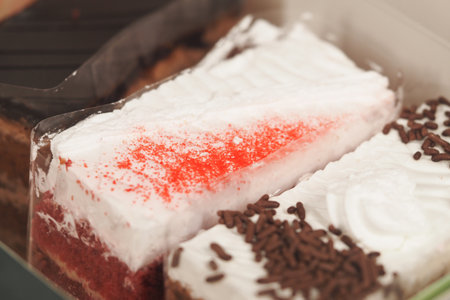 Colorful dessert arrangement in a display caseの写真素材