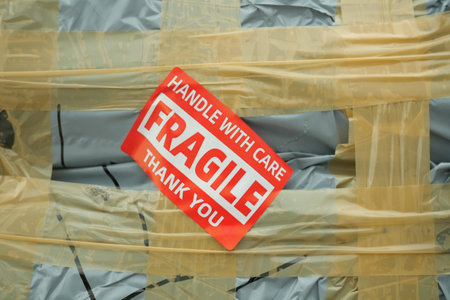 Package with fragile notice at shipping warehouseの写真素材