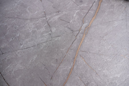 Detailed texture of a modern stone surface in grayの写真素材