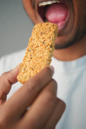 Enjoying a nutritious snack bar in a casual settingの写真素材