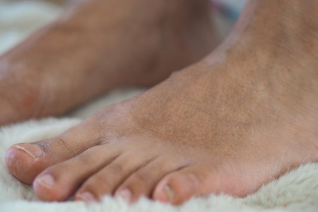 Close-up of bare dry feet on soft surface in home setting
