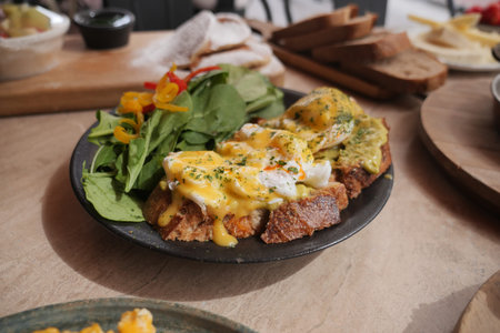 Delicious brunch plate with eggs and greens in a cozy cafe