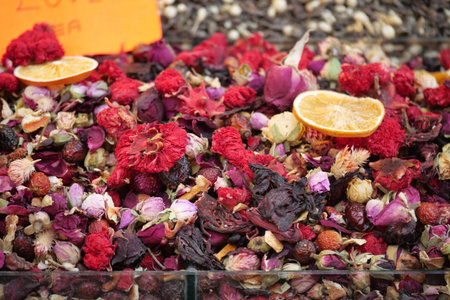 Colorful display of dried flowers and herbs in local marketの写真素材