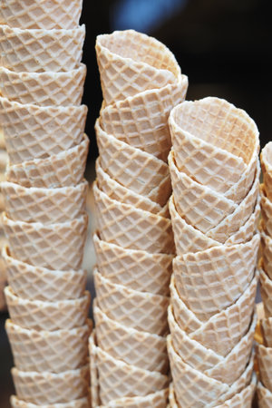 Stacks of empty ice cream cones ready for summer treatsの写真素材