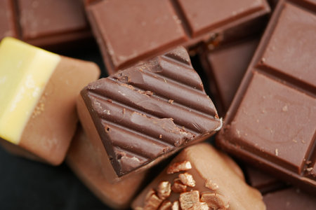 Chocolates arranged in a tempting display on a dark surface