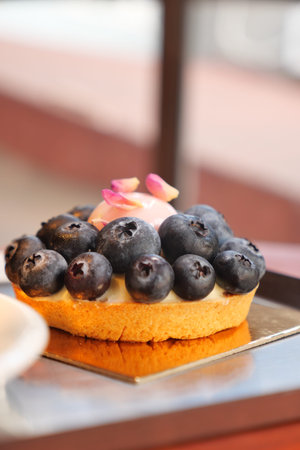 Delicious blueberry tart served in a cozy cafe setting