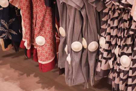 Colorful patterned fabrics with tag in a store display
