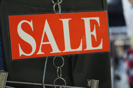 Bright sale sign hanging in a retail store