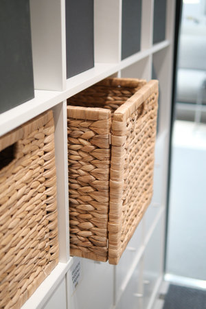 Bamboo storage baskets in modern shelving unit