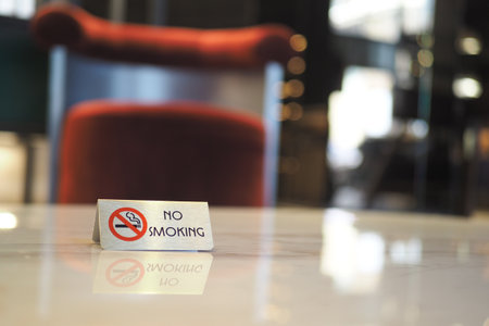 Sign indicating no smoking in a modern cafe settingの写真素材
