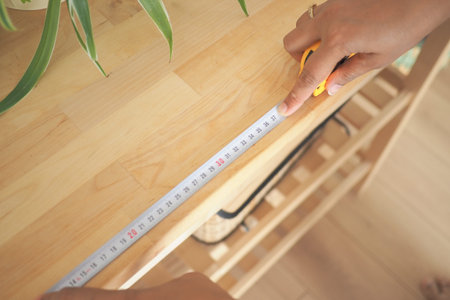 Measuring wood surface in home for project planning