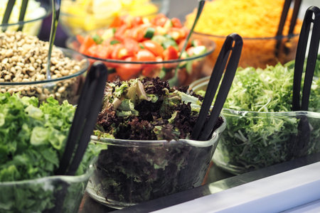 Fresh vegetables and salad toppings in a vibrant display