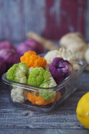Colorful cauliflower varieties in a glass containerの写真素材
