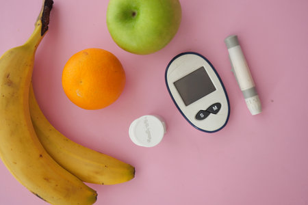 Healthy snack options and diabetes testing kit on tableの写真素材