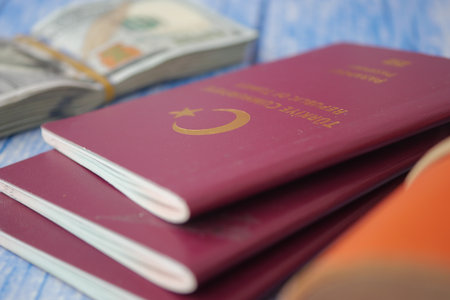 Turkish passports and money on a wooden tableの写真素材