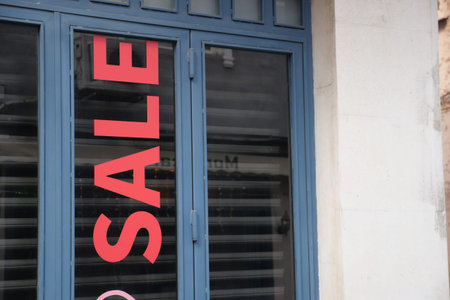 Shopfront promoting sale with bold red letteringの写真素材