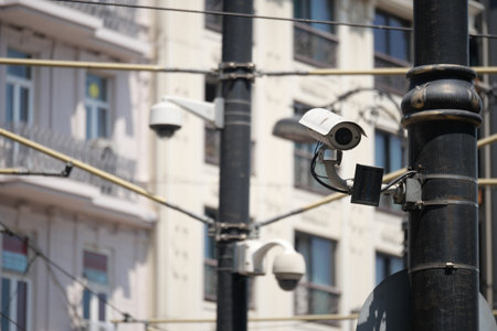 Cameras monitor city streets during the dayの写真素材