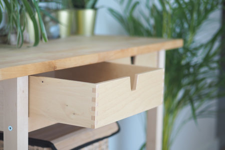 Wooden furniture with open drawer in modern spaceの写真素材