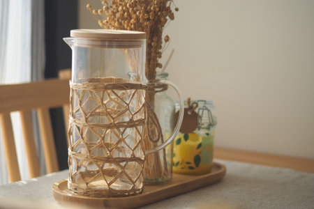 Refreshing drinks served on a wooden tray in a sunny settingの写真素材