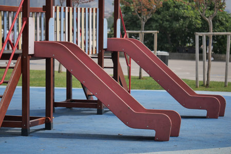 Two playground slides ready for children to enjoy funの写真素材