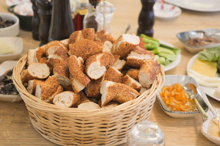 Freshly baked bread rolls in a served basket at brunch