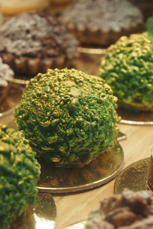 Unique green dessert displayed at bakery showcase