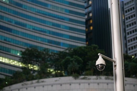 Modern security camera in urban area during eveningの写真素材